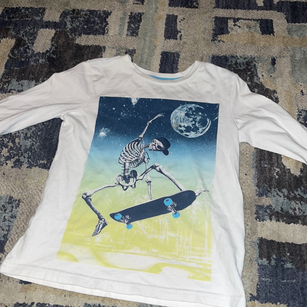 Skating skeleton under the moon! Cool shirt!